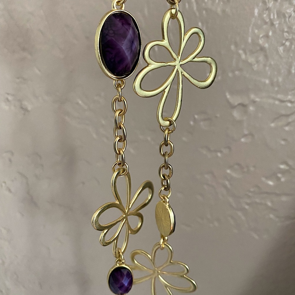 New. Long necklace gold detail with purple “gems”